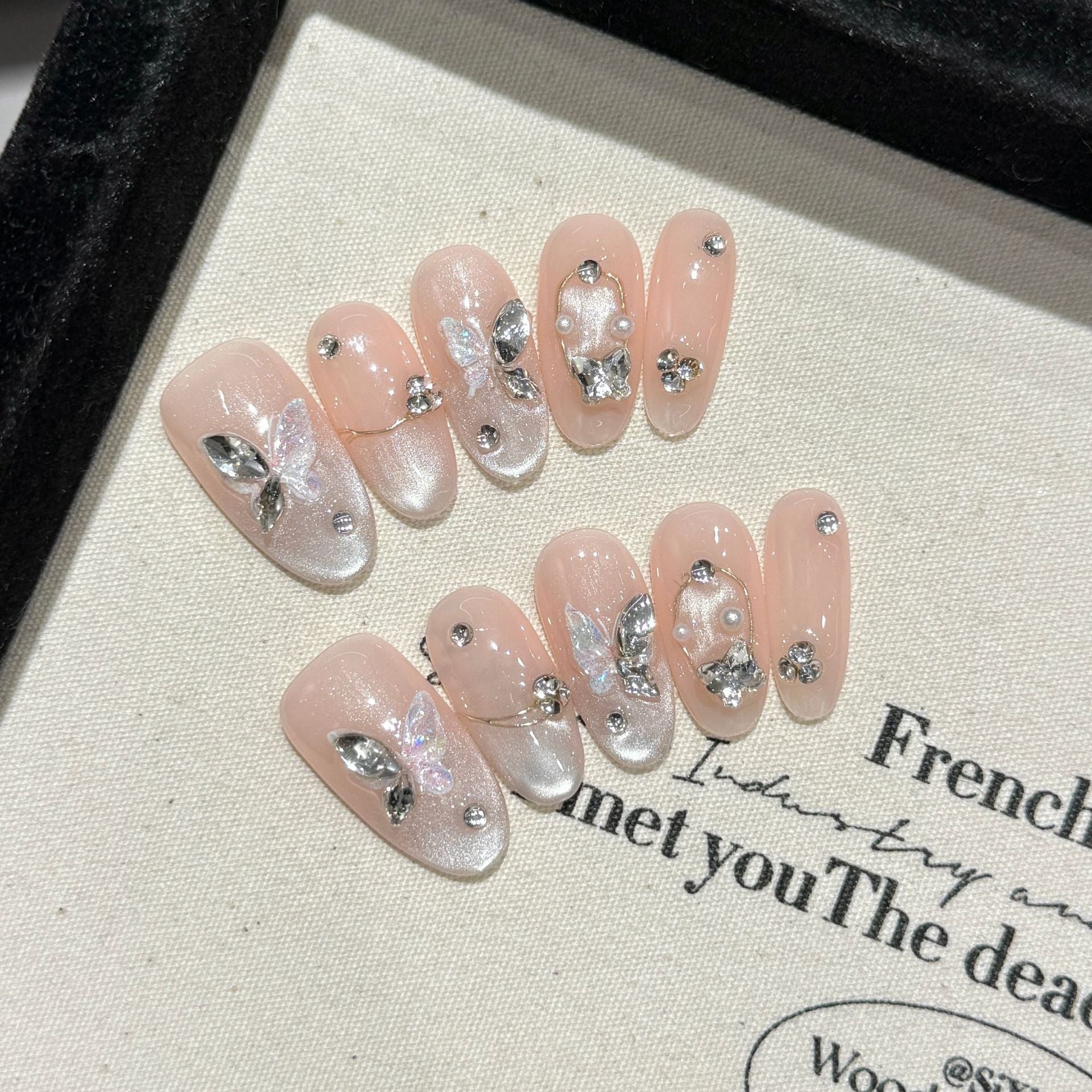 Handmade Press On Nails Medium Almond Wings of a dish